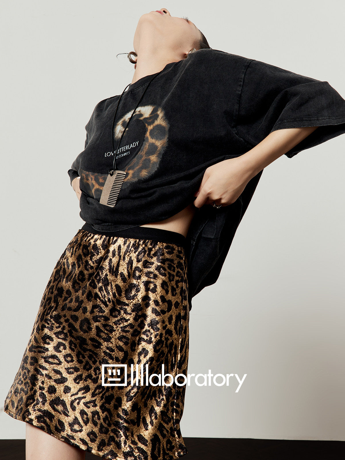 Relaxed-fit washed black short-sleeve graphic tee styled on a model