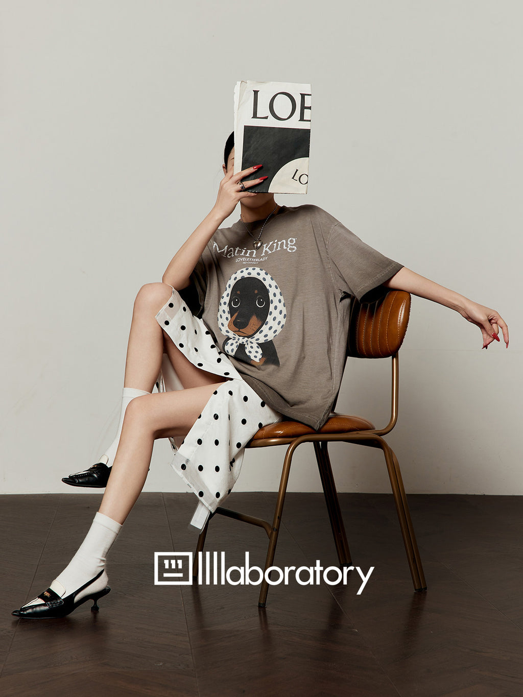 Relaxed lifestyle styling of the scarf-pup tee and white skirt