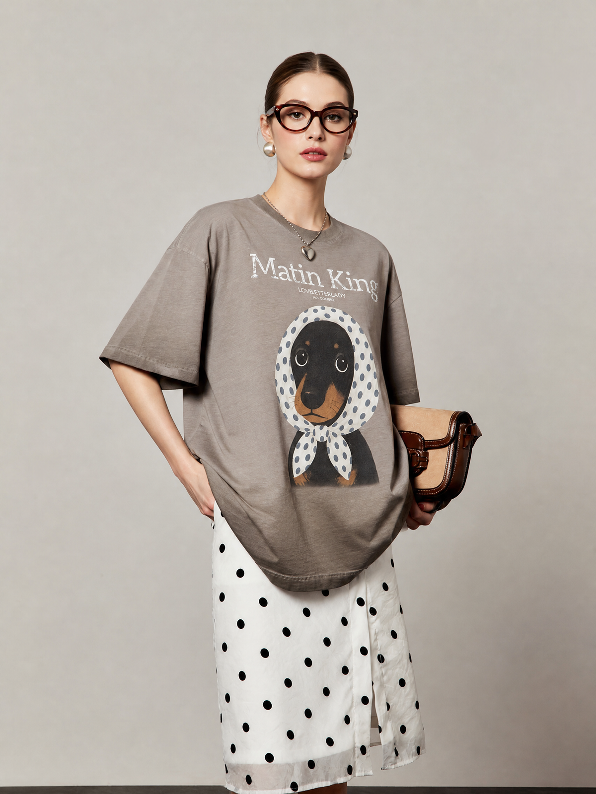 Portrait view of the relaxed coffee-brown scarf-pup graphic T-shirt
