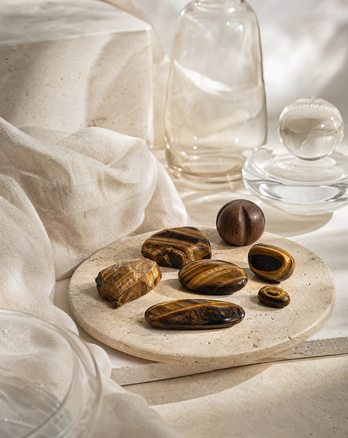 Natural tiger’s eye stones arranged with walnut wood